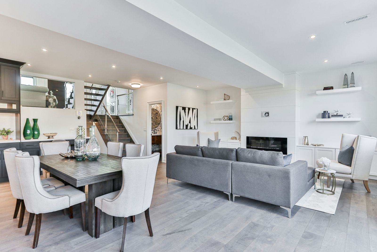Finished interior of a renovated home with new trim, flooring and natural light