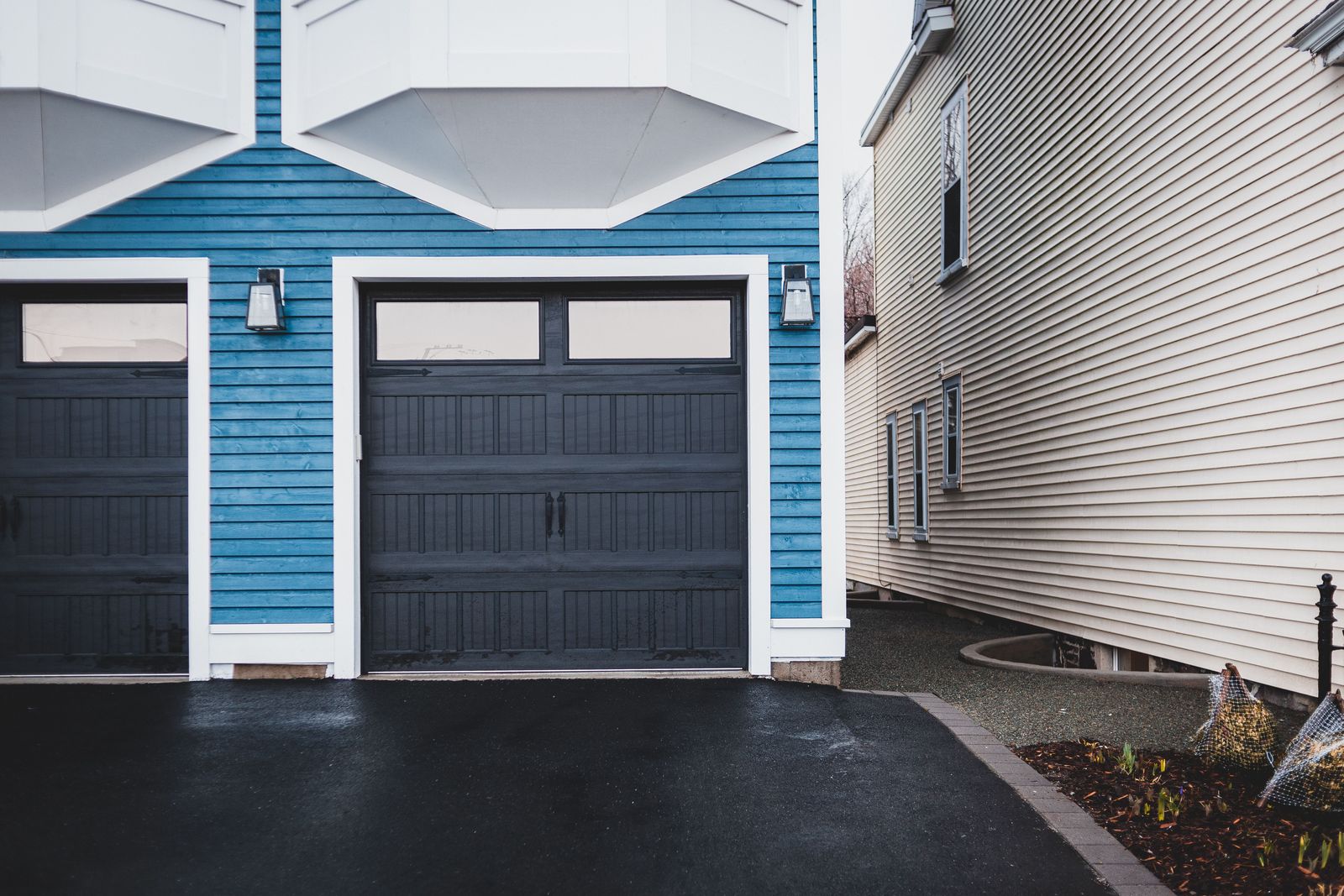 Home exterior with lap siding, white trim and an attached garage